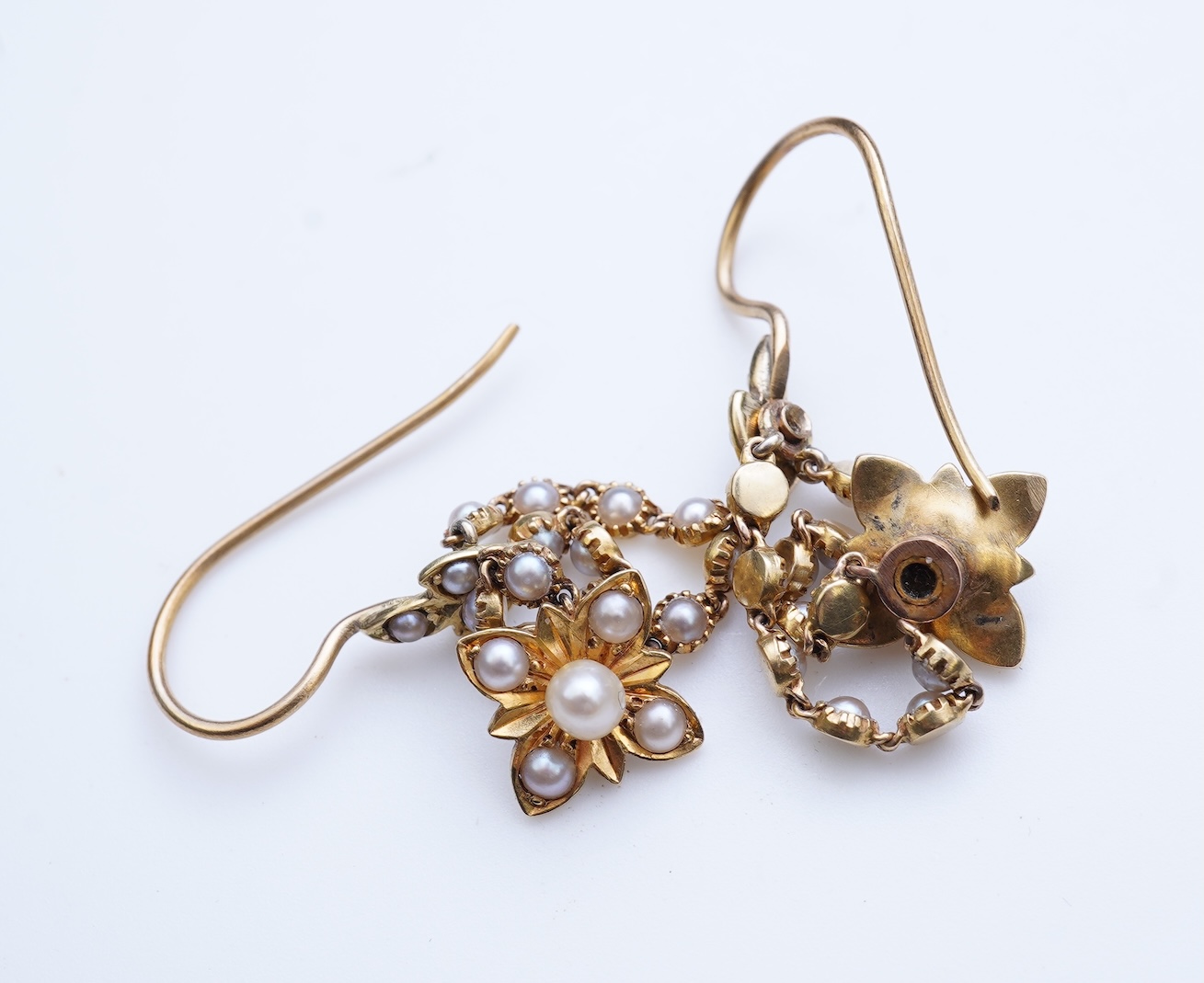 A pair of Edwardian seed pearl earrings, early 20th century composite